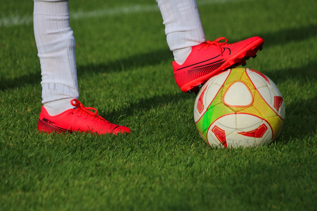 ball, football, sport, soccer, soccer ball, football shoes, soccer shoes, football field, soccer field, grass, nature, athlete, football player, soccer player, legs, feet, footwear