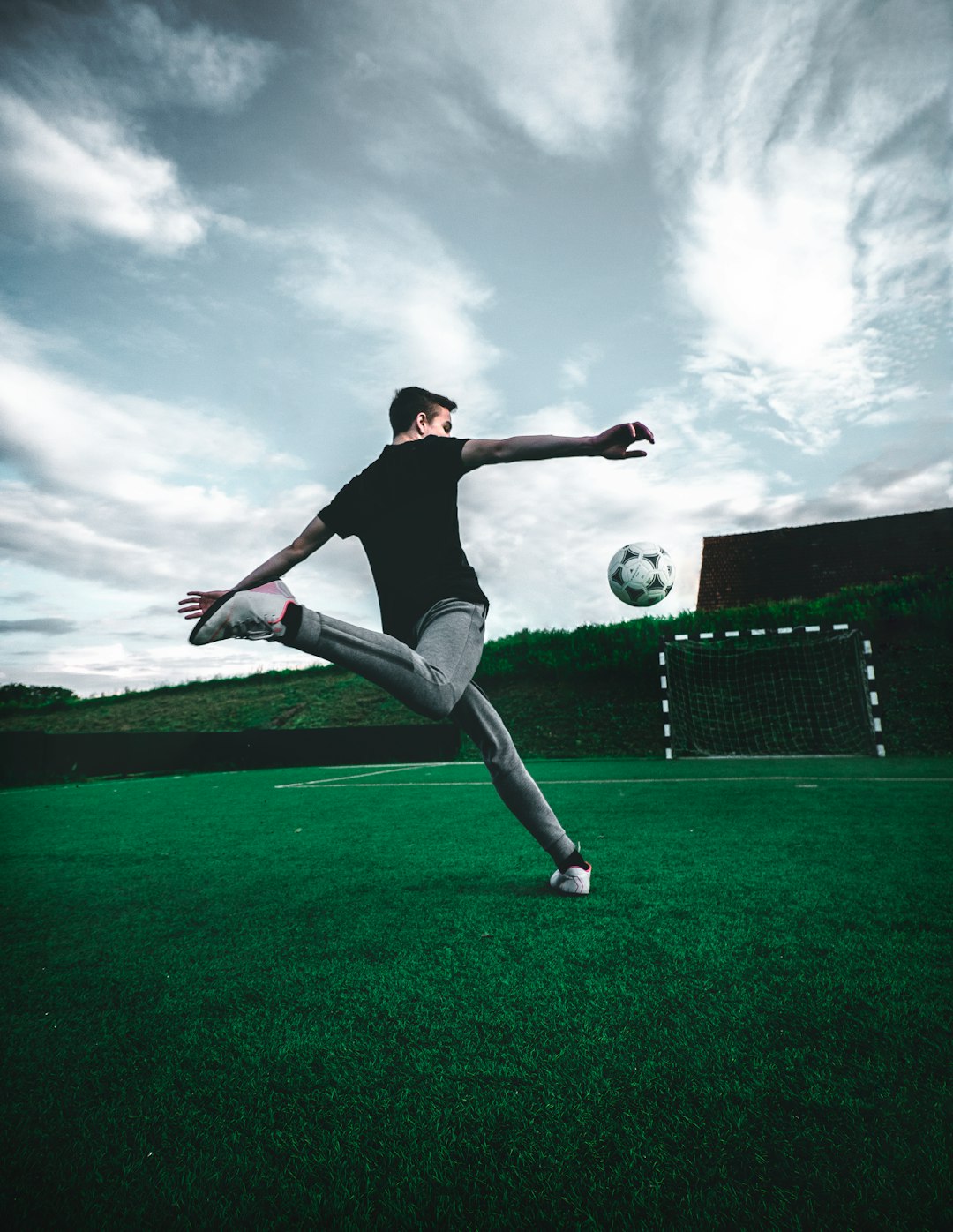man-playing-soccer-during-daytime-z0kjmjxusks